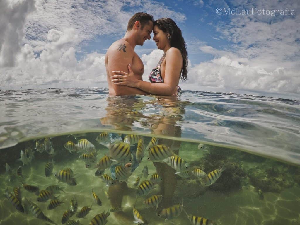 Couple celebrating their Honeymoon in natural pools of Porto de Galinhas