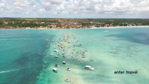Aerial view of Praia de Antunes Barra Grande with turquoise water and boats